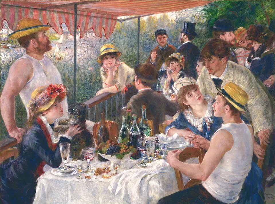 People dining together at a lively outdoor party.